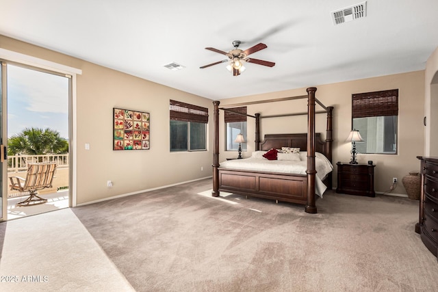 bedroom with light colored carpet, access to outside, visible vents, and baseboards