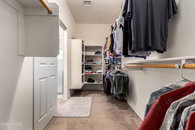 walk in closet with carpet and visible vents