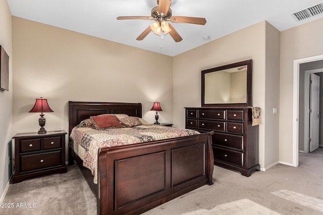 bedroom featuring light carpet, ceiling fan, visible vents, and baseboards