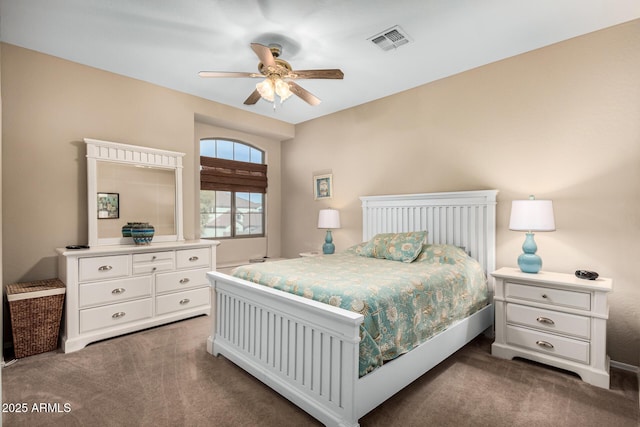 carpeted bedroom featuring visible vents and a ceiling fan