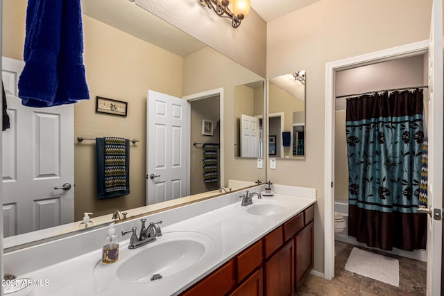 bathroom featuring toilet, shower / tub combo, double vanity, and a sink