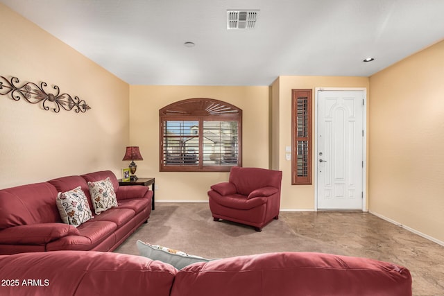 living room featuring carpet floors, baseboards, and visible vents