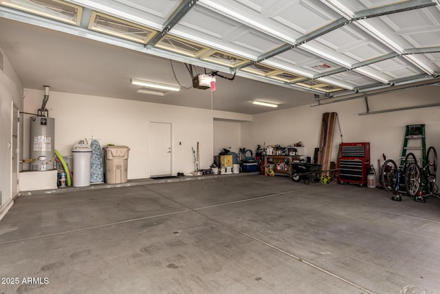 garage with water heater and a garage door opener