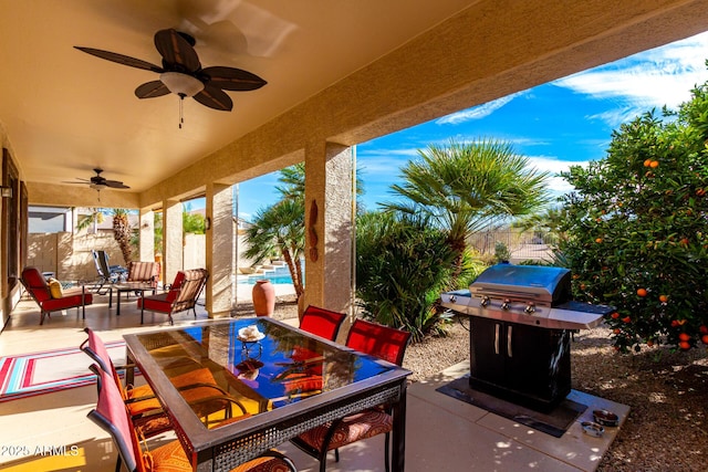 view of patio / terrace featuring fence private yard, ceiling fan, and outdoor dining space