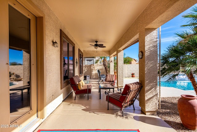 view of patio / terrace featuring a ceiling fan and fence