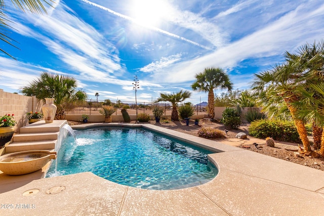 view of swimming pool featuring a patio, a fenced backyard, and a fenced in pool