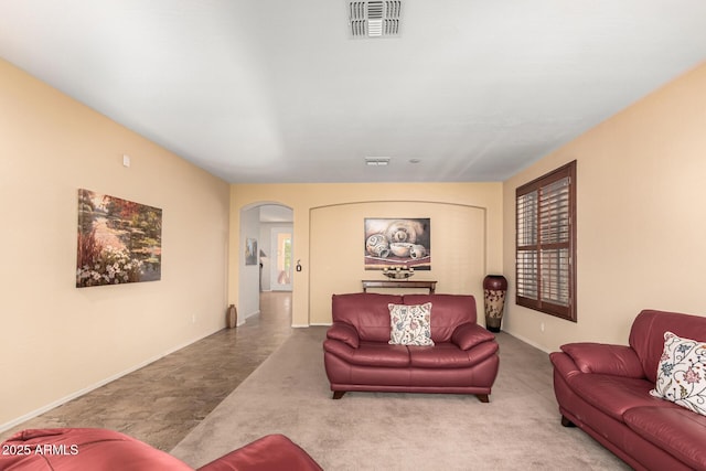 living room with visible vents and arched walkways