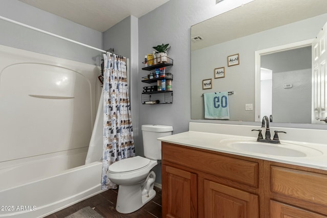 bathroom with toilet, visible vents, shower / tub combo with curtain, and vanity