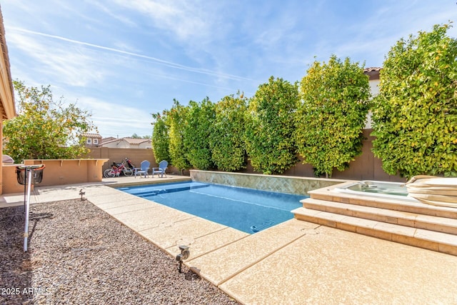 view of pool featuring an in ground hot tub, a fenced backyard, a fenced in pool, and a patio