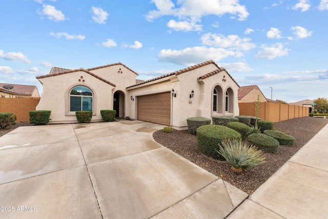 mediterranean / spanish-style home featuring a garage