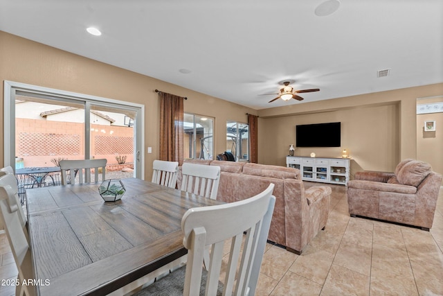 dining area with ceiling fan and light tile patterned floors