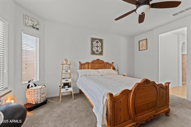 carpeted bedroom featuring ceiling fan