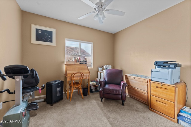 living area featuring light carpet and ceiling fan