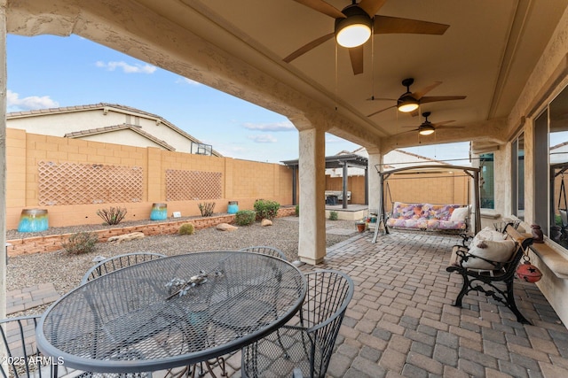 view of patio / terrace featuring ceiling fan