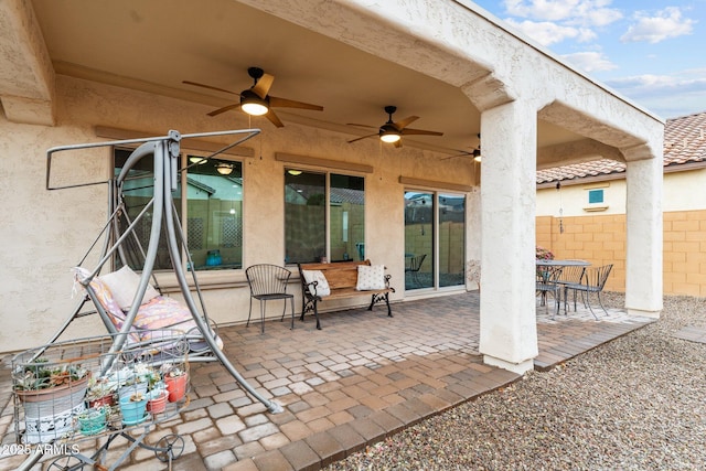 view of patio featuring ceiling fan