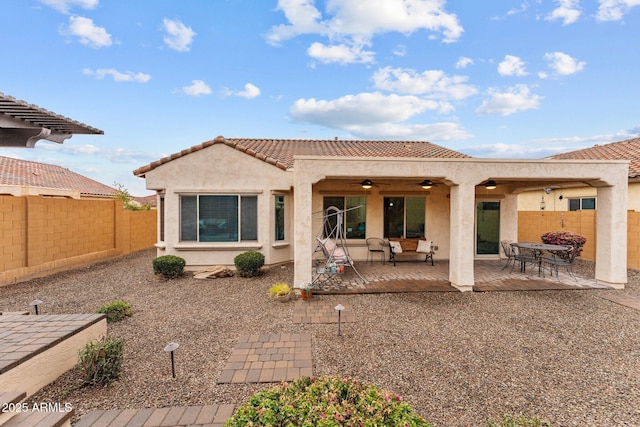 back of house with a patio and ceiling fan