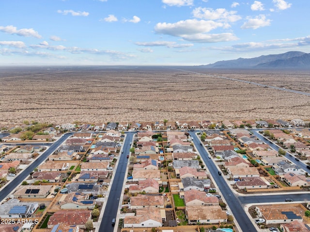 birds eye view of property with a mountain view