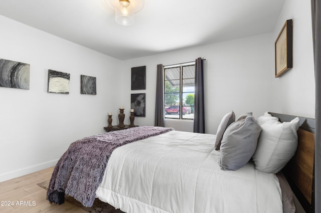 bedroom with hardwood / wood-style flooring