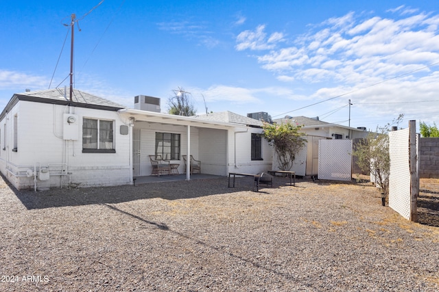 view of front of property with a patio and cooling unit