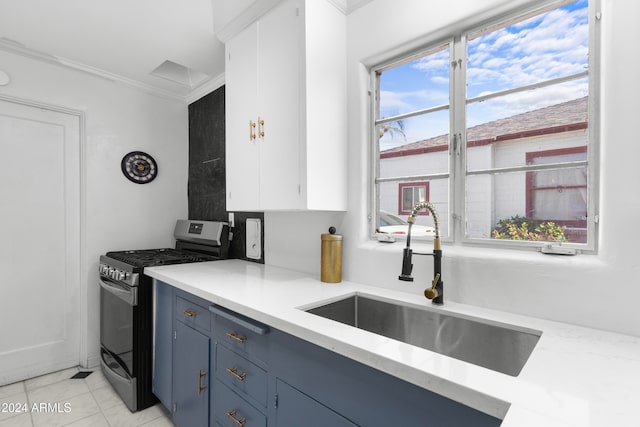 kitchen featuring white cabinetry, ornamental molding, sink, and stainless steel gas range