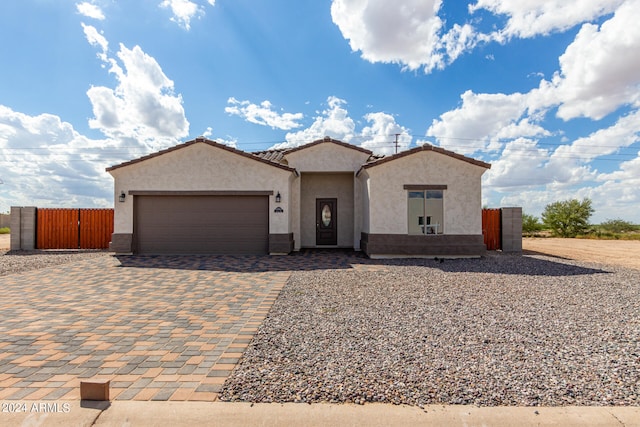 mediterranean / spanish-style home featuring a garage