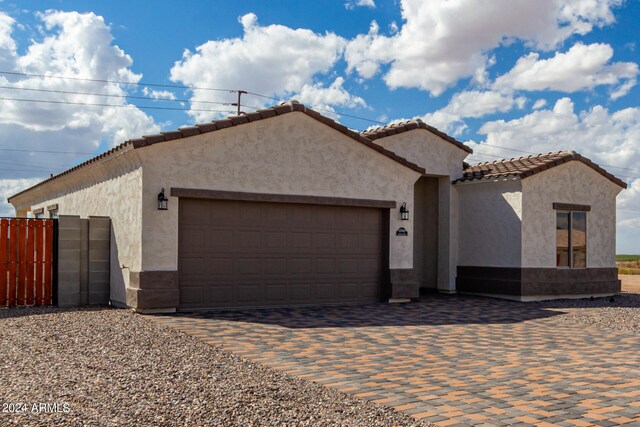 mediterranean / spanish-style house featuring a garage