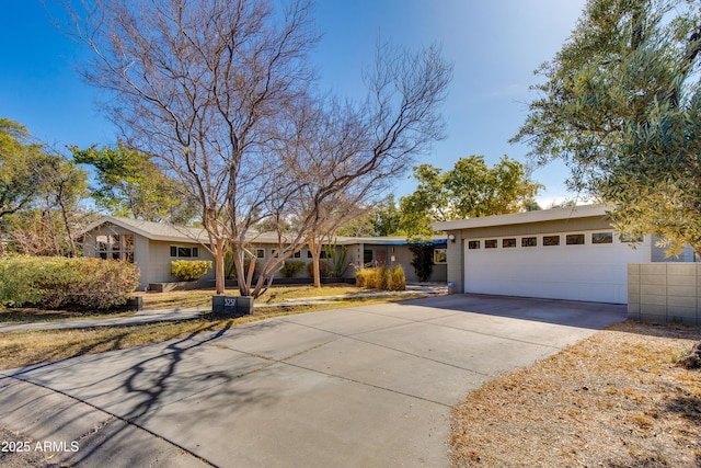 ranch-style house featuring a garage