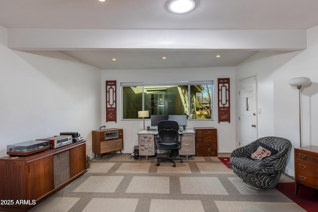 carpeted office space with beamed ceiling