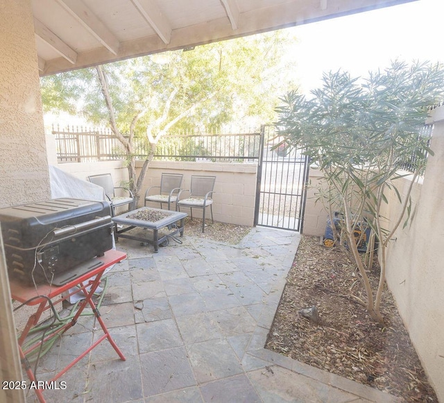 view of patio / terrace featuring a fire pit