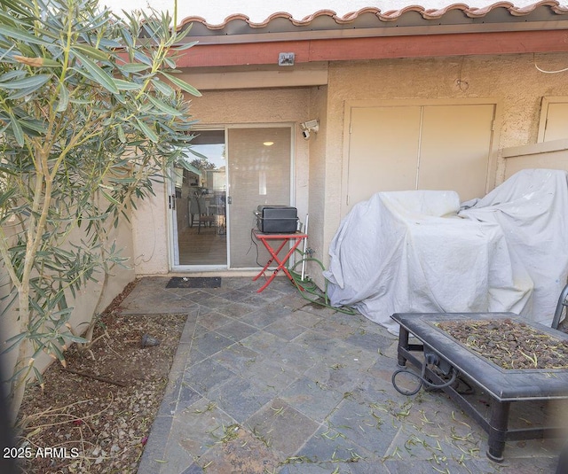 entrance to property with a patio area