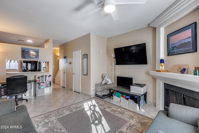 tiled living room featuring ceiling fan