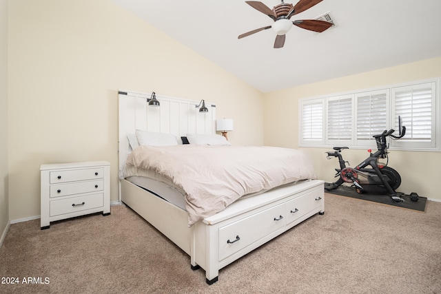 bedroom featuring light carpet, vaulted ceiling, and ceiling fan