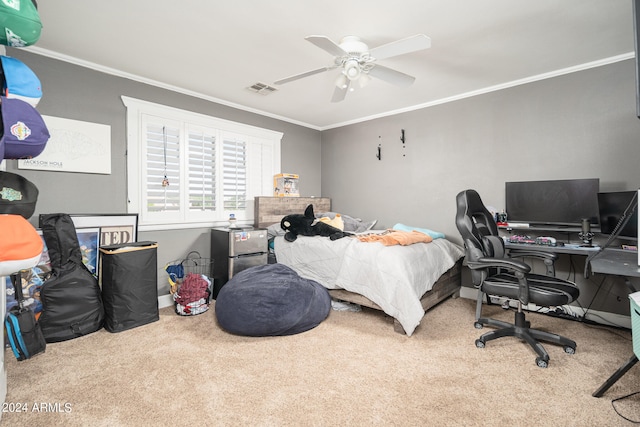 carpeted bedroom with ornamental molding and ceiling fan