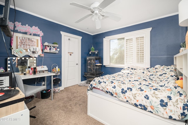 carpeted bedroom with ornamental molding and ceiling fan