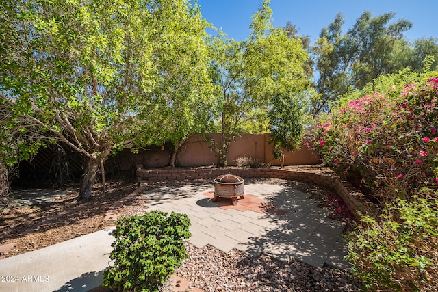 view of patio / terrace featuring a fire pit