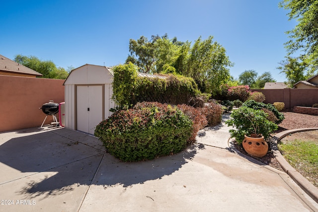 view of patio with a storage unit