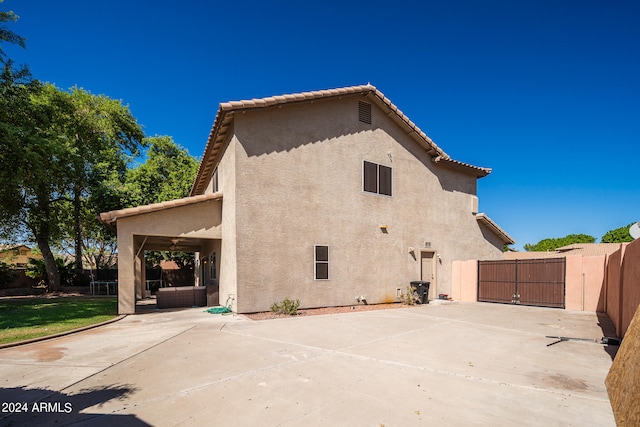 view of side of home featuring a patio