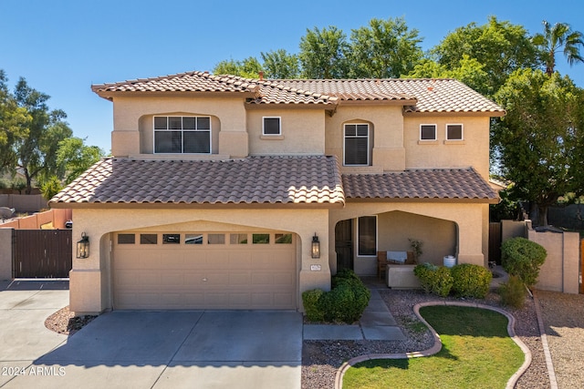 mediterranean / spanish-style home featuring a garage