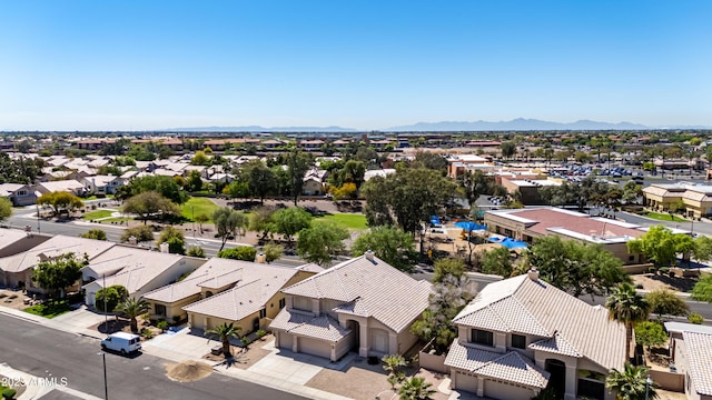 birds eye view of property featuring a mountain view and a residential view