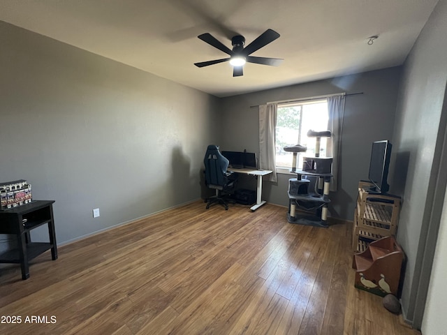2564 Mockingbird Dr, Sierra Vista, AZ 85635 - office space with wood-type flooring, a ceiling fan, and baseboards