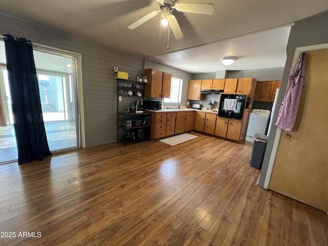 2564 Mockingbird Dr, Sierra Vista, AZ 85635 - kitchen with dark wood-style flooring, a sink, black oven, and ceiling fan