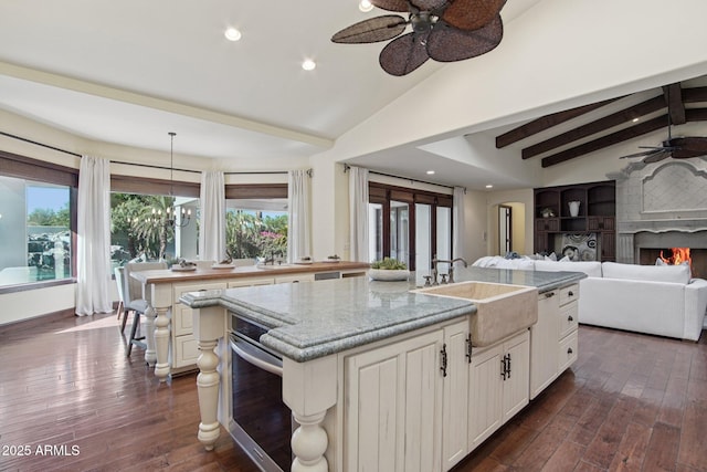 1330 N 40th St Unit 1, Mesa, AZ 85205 - kitchen with ceiling fan, an island with sink, recessed lighting, open floor plan, and dark wood-style floors