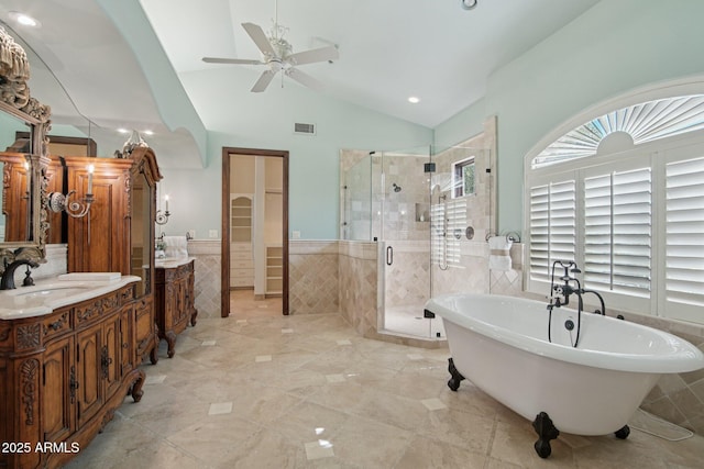 1330 N 40th St Unit 1, Mesa, AZ 85205 - bathroom featuring tile walls, a stall shower, vanity, a freestanding tub, and a ceiling fan