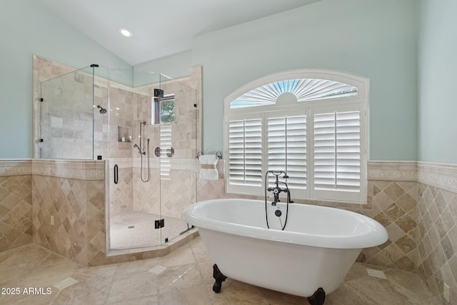 1330 N 40th St Unit 1, Mesa, AZ 85205 - bathroom featuring tile walls, a soaking tub, a wainscoted wall, a stall shower, and tile patterned floors
