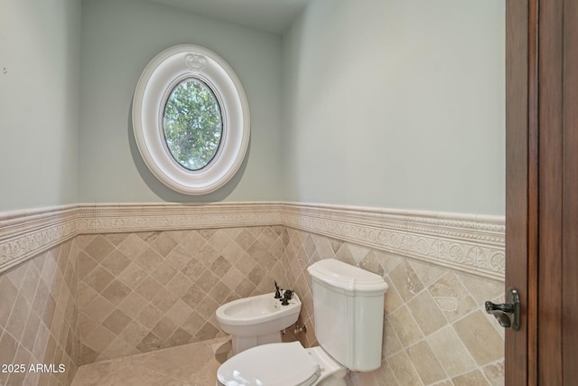 1330 N 40th St Unit 1, Mesa, AZ 85205 - half bathroom featuring a bidet, a wainscoted wall, and tile walls