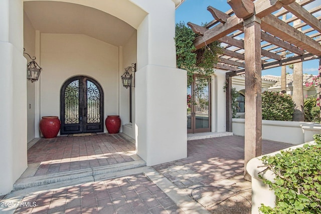 1330 N 40th St Unit 1, Mesa, AZ 85205 - view of exterior entry with french doors, stucco siding, and a pergola