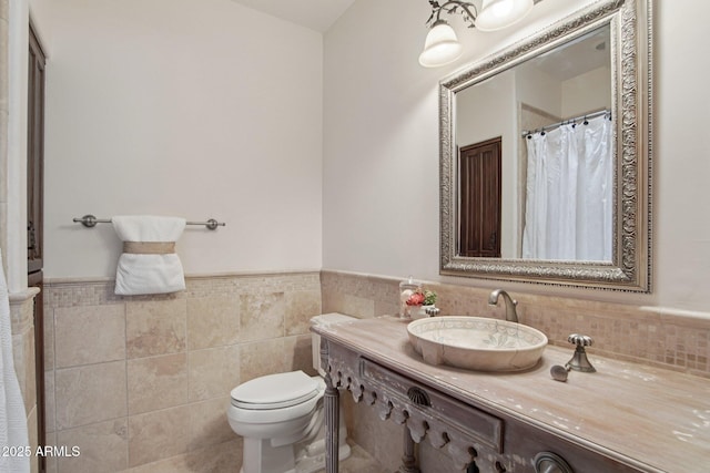 1330 N 40th St Unit 1, Mesa, AZ 85205 - bathroom featuring tile walls, vanity, and a wainscoted wall