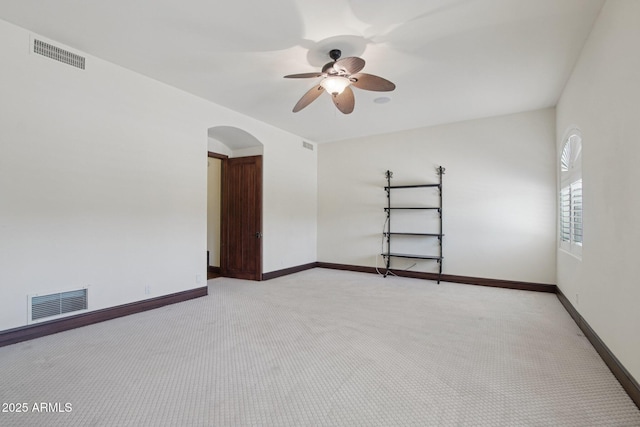 1330 N 40th St Unit 1, Mesa, AZ 85205 - unfurnished room with light carpet, arched walkways, and ceiling fan