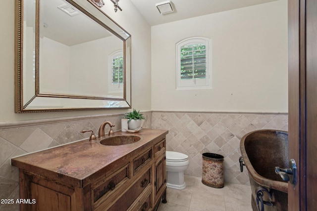 1330 N 40th St Unit 1, Mesa, AZ 85205 - bathroom featuring tile walls, vanity, tile patterned flooring, and wainscoting