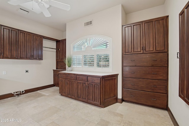 1330 N 40th St Unit 1, Mesa, AZ 85205 - kitchen with a ceiling fan, light countertops, and dark brown cabinetry